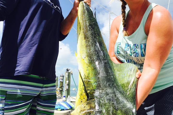 a person holding a fish