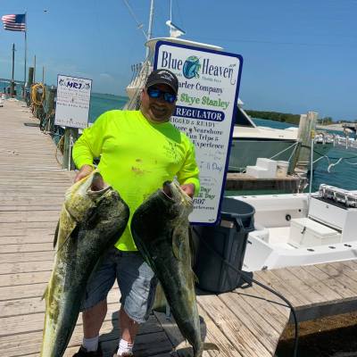 a man holding a fish
