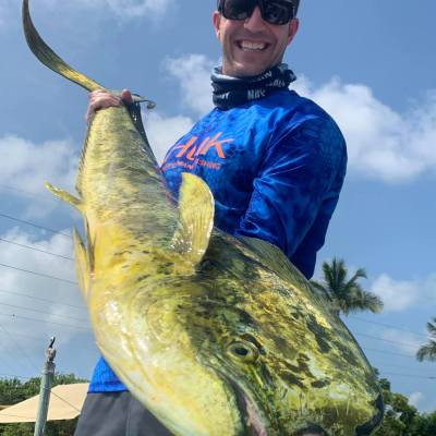 a man holding a fish