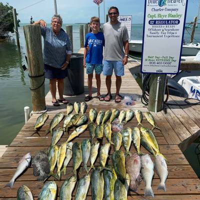 a group of people walking down a fish